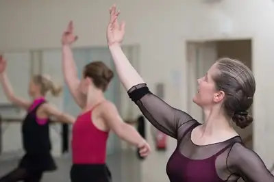 Adult Ballet dancers practising in class