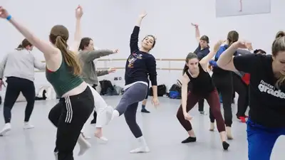 Ballet dancers taking a class in the studio