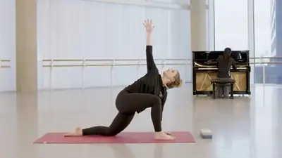 Dancer stretching in a studio