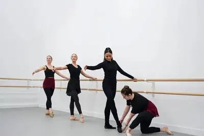 Teacher correcting a student in the studio